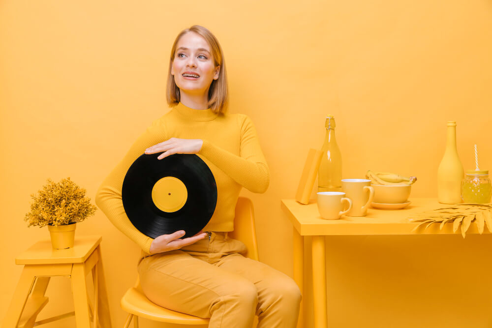 Happy Woman with Vinyl Record - Music Record Shop